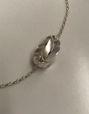 Silver bud on a sterling chain. Not for sale.